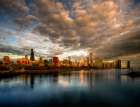 Chicago skyline shimmers at sunrise over lake Michigan Art Print